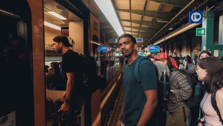 Intrepid travellers board their train in an Italian station