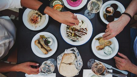 Group of  travellers enjoy a relaxed lunch in Vienna