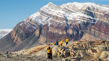 Travellers hiking in Hiking in Skipperdal Valley northeast Greenland