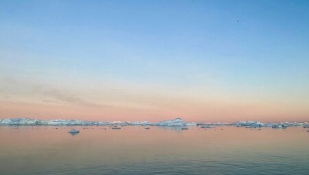 Sunset refracted off Disko Bay and its many icebergs
