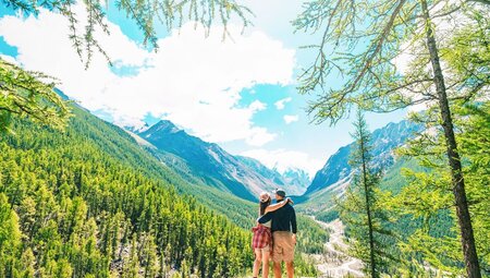 Travellers looking out at the end of a taiga hike in Mongolia