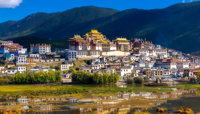Golden rooves of Sumtsenling Monastery atop the town of Shangri-La, Yunnan Province, China