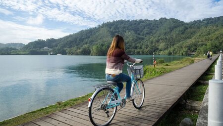 Traveller on classic style bicycle cycling