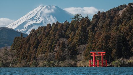 Hakone shrine gate with Mount Fuji looming beyond in autumn in Japan