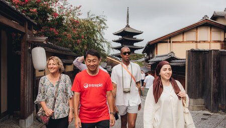 Group of Intrepid travellers with leader Hiro exploring the historic streets of Sannenzaka and Ninenzaka
