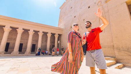 Travellers amongst the ruins of Aswan in Egypt