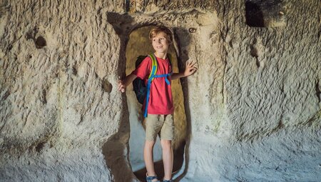 Young Intrepid traveller exploring the caves of Cappadocia