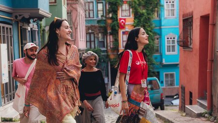 Leader and travellers exploring the colourful streets of Balat district, Istanbul