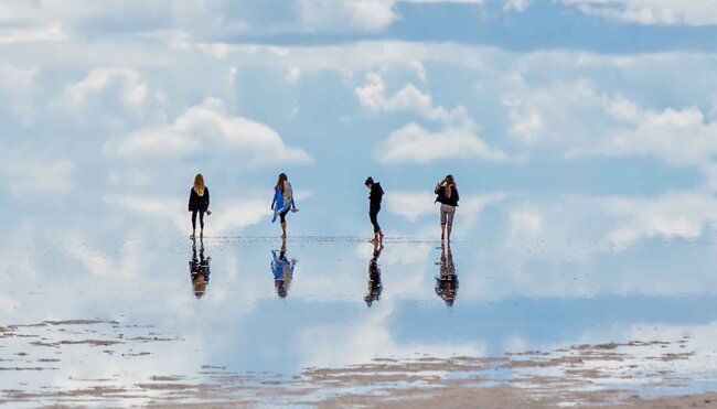 Four travellers explore the salt flats of Bolivia