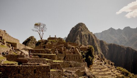 Travellers exploring the ruins of Machu Picchu