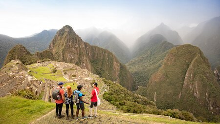 GGPI - Group of travellers standing viewing Machu Picchu from a distance