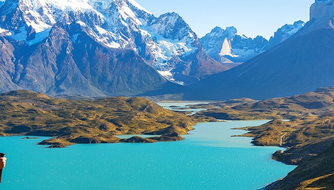 Hiker standing in front of the mountains in Torres del Paine NP, Chile