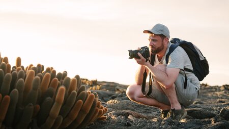 Traveller photographing flora on Galapagos Islands