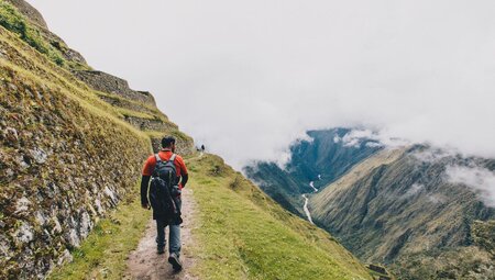 Traveller hiking on path on Inca Trail in Peru