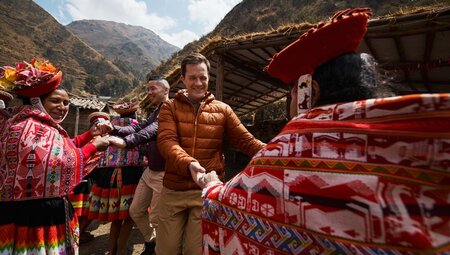Intrepid travellers enjoy a dance with women of the Huilloc Community in Sacred Valley
