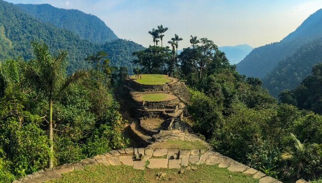 Travellers look around the Lost City of the Tayrona people sits in the Sierra Nevada mountains in northwestern Colombia