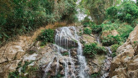 White water cascading down at Marinka Waterfall in tropical rainforest of Colombia