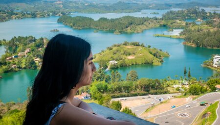 Traveller enjoying the view of reservoir in Guatape, Colombia