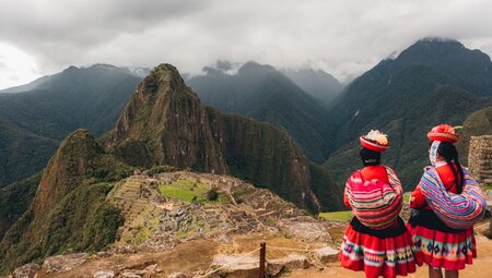 Two women from Sacred Valley community looking out at Machu Picchu for the first time