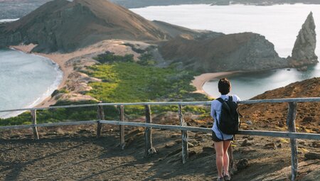 Traveller looking over Galapagos Island landscape, Ecuador