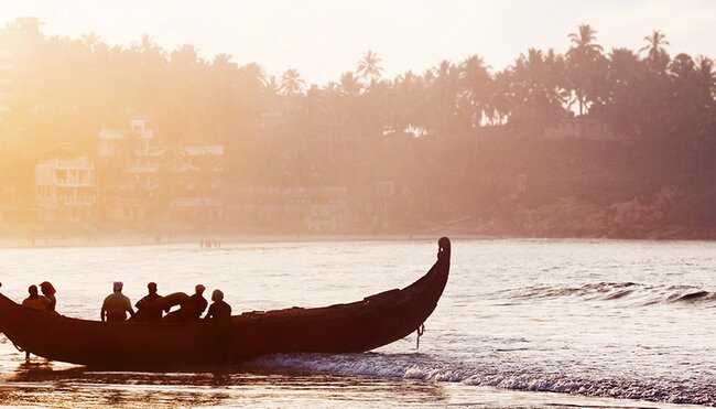 india kerala boats beach sunset silhouettes