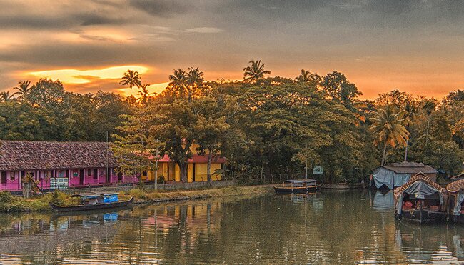HHPWC - Sunset views of the Kerala Backwaters surrounded by palm trees