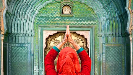 Woman praying at a temple in Rajasthan in India