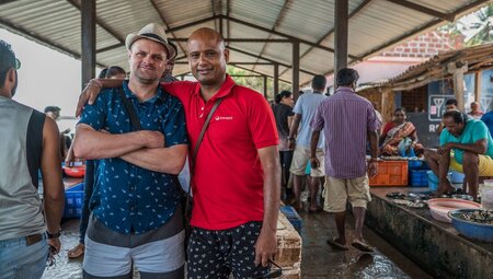 Intrepid leader and traveller embrace for a photo while exploring Goa, India