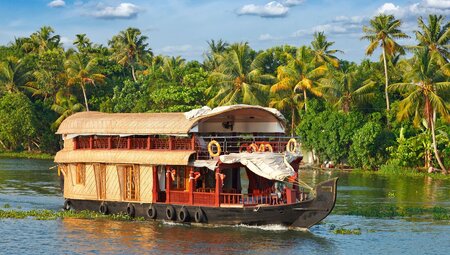 Cruising Nileshwar backwaters on an iconic houseboat in southern India