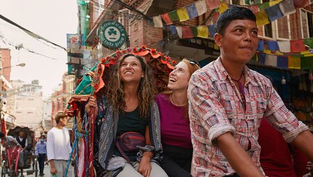 travellers in Kathmandu travelling by rickshaw, Nepal