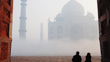 HHPG - Couple sitting in front of the Taj Mahal in the fog