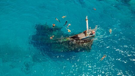 Drone view of travellers swimming at Keyodhoo shipwreck