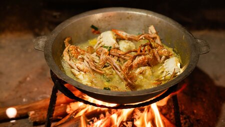 Crab curry being cooked at the cooking demonstration in Mirissa, Sri Lanka