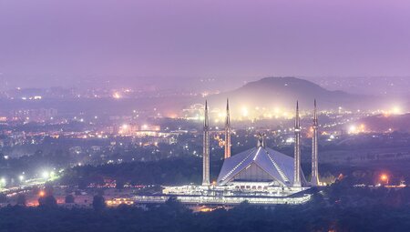 Aerial view of Faisal Mosque in Islamabad with purple sky