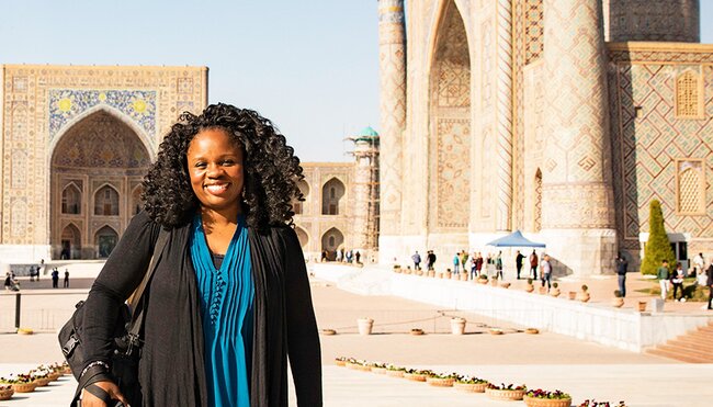 KFPU - Pax smiling in front of Registan Square in Samarkand, Uzbekistan