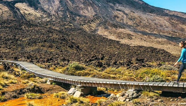 Travellers about to ascend the trail up Tongariro Crossing, North Island, New Zealand