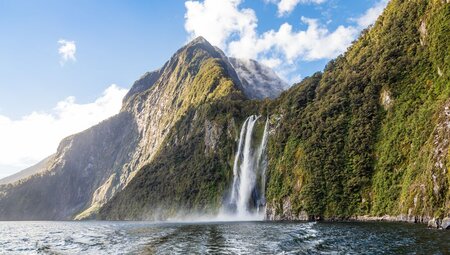 Towering Stirling Falls pours into Doubtful Sound in Southland New Zealand