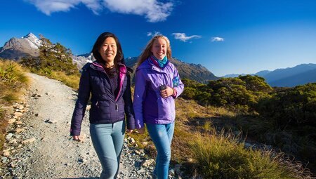 Travellers hiking Routeburn Track, New Zealand
