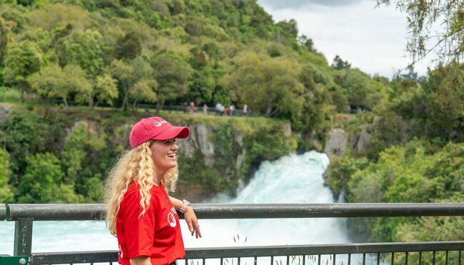 Smiling Leader standing at the rails at Huka Falls, New Zealand