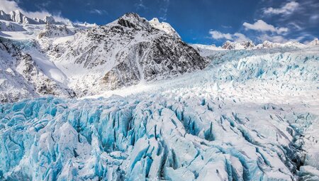 Icy snowcapped peaks of Franz Josef Glacier, New Zealand