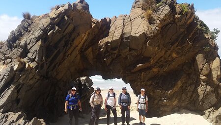 Group walking along Cape Queen Elizabeth, Bruny Island, Tasmania