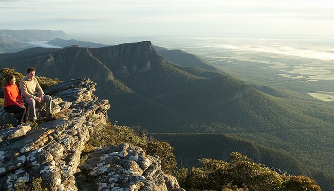 Travellers sitting on Baronia Peak in Grampians National Park, Victoria