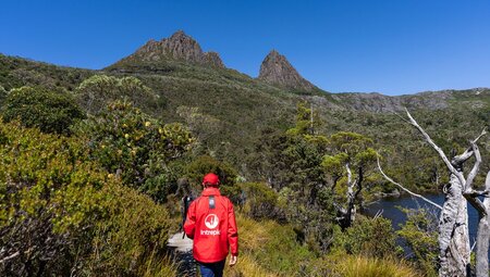 Back of leader in red Intrepid jackett on Dove Lake Cradle Mountain hike