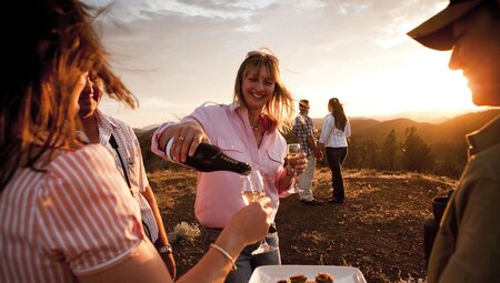 Sundown drinks and canape service on the hills at sunset