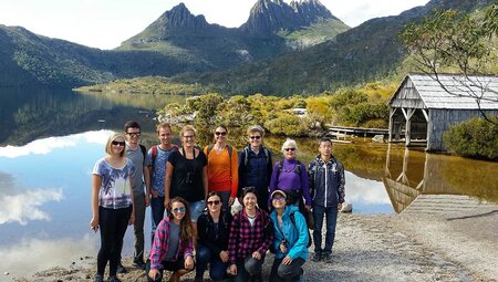 PUKT - Group of travellers posing in front of Cradle Mountain, Tasmania