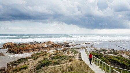 PUKT - Traveller walking down to Edge of the World, Arthur River, Tasmania