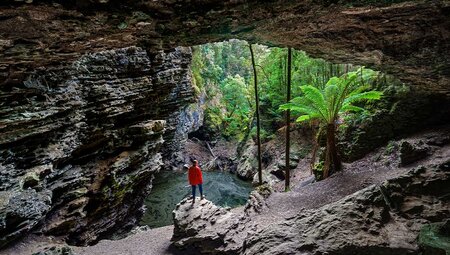 PUKT - Traveller looking through Trowutta Arch, Tasmania