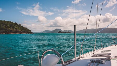 View of Whitsunday Islands from boat while sailing