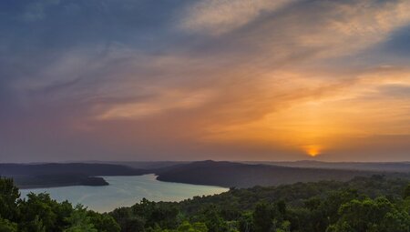 Sunset over Yaxha-Nakum-Naranjo National Park seen from the pyramids