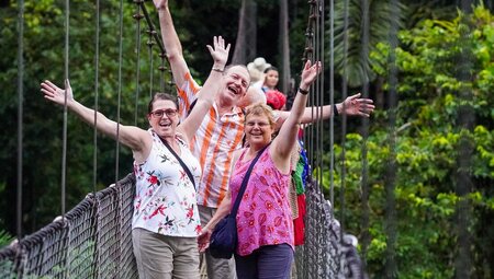 Travellers having a fun time on hanging bridge at La Fortuna, Costa Rica
